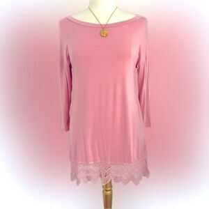 Adorable & comfy boutique Emerald pink dress with fun detailing at the bottom!